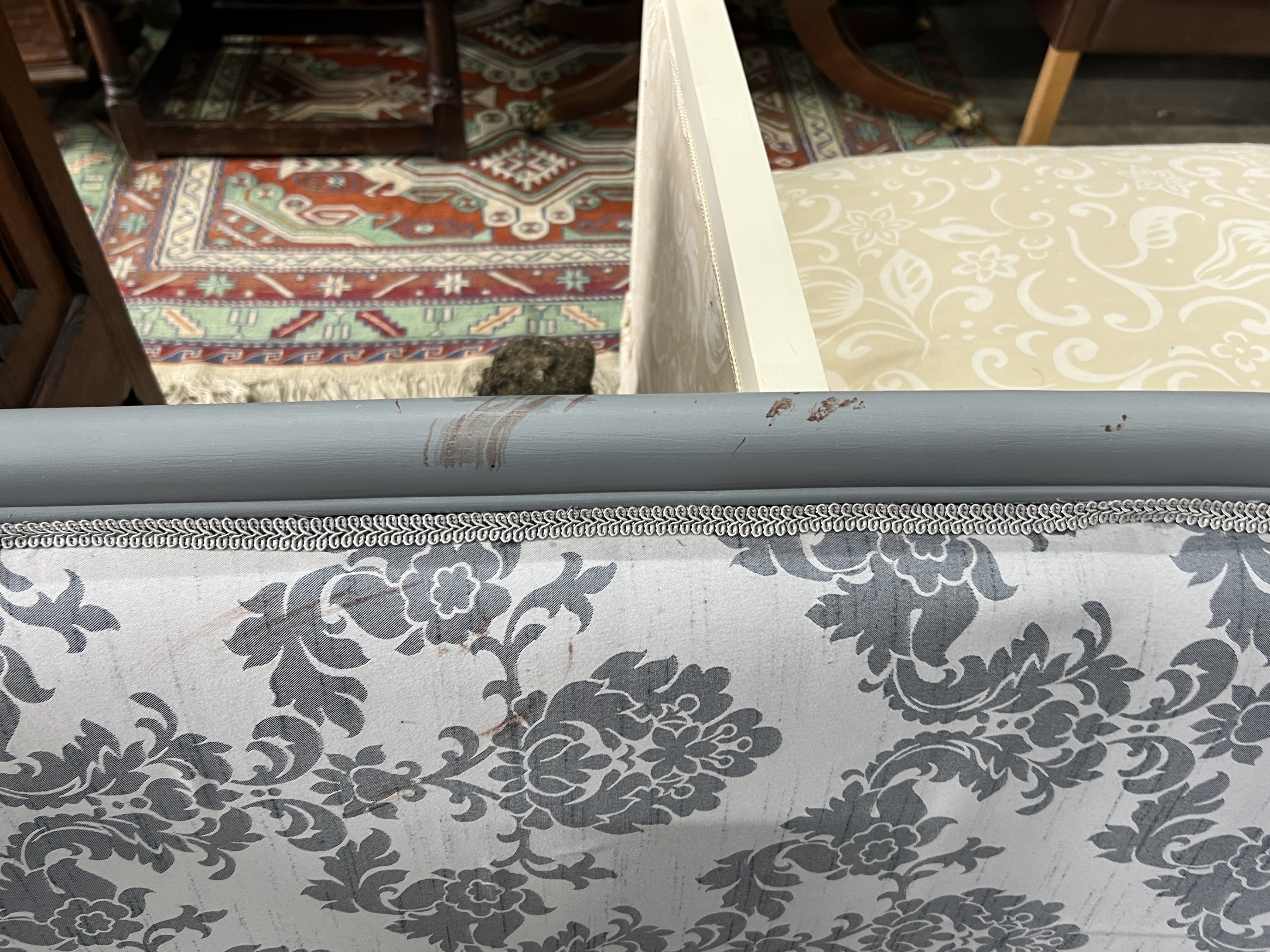 A Louis XVI style upholstered grey painted tub framed two seater settee, length 119cm, depth 60cm, height 82cm